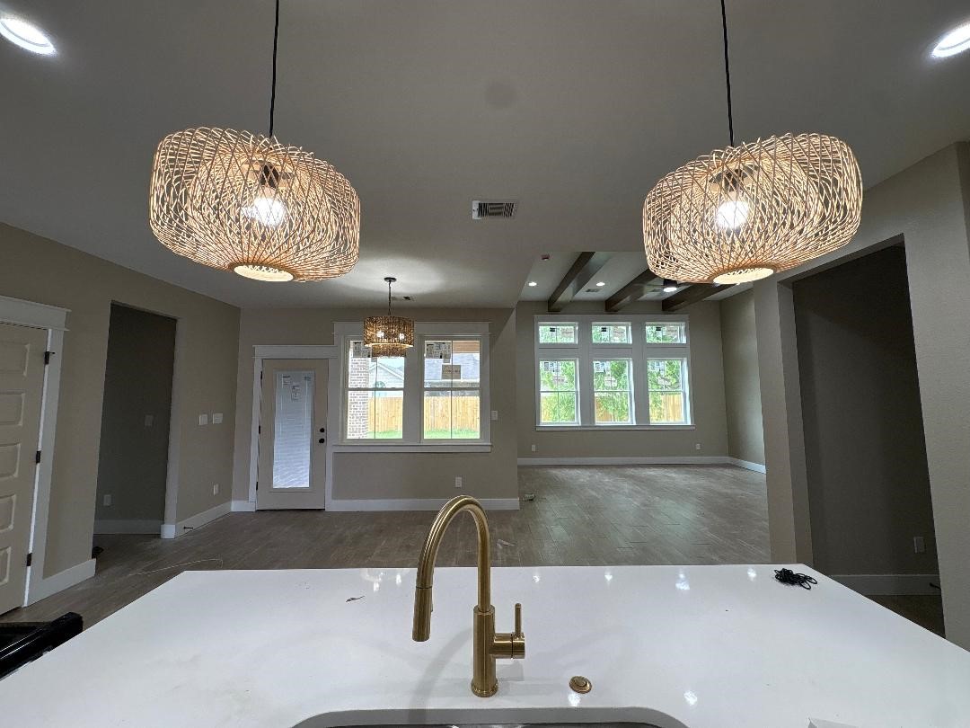 5680 Essie Lane Beaumont, TX 77713 - Photo 8 of 22 a kitchen with a chandelier and chandelier