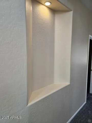 a kitchen with a refrigerator and a stove top oven