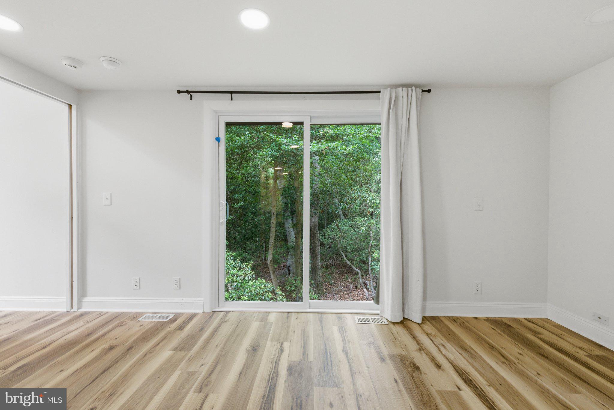 11492 Rawhide Road Lusby, MD 20657 - Photo 9 of 20 Serene view through expansive windows.