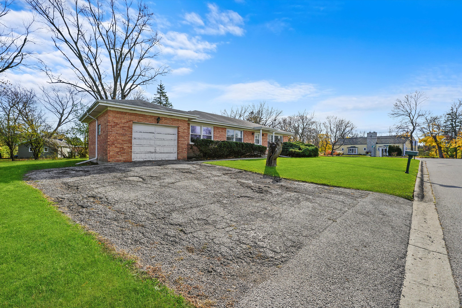 1725 North Happ Road Northbrook, IL 60062 - Photo 32 of 33 a view of a house with a yard and large trees