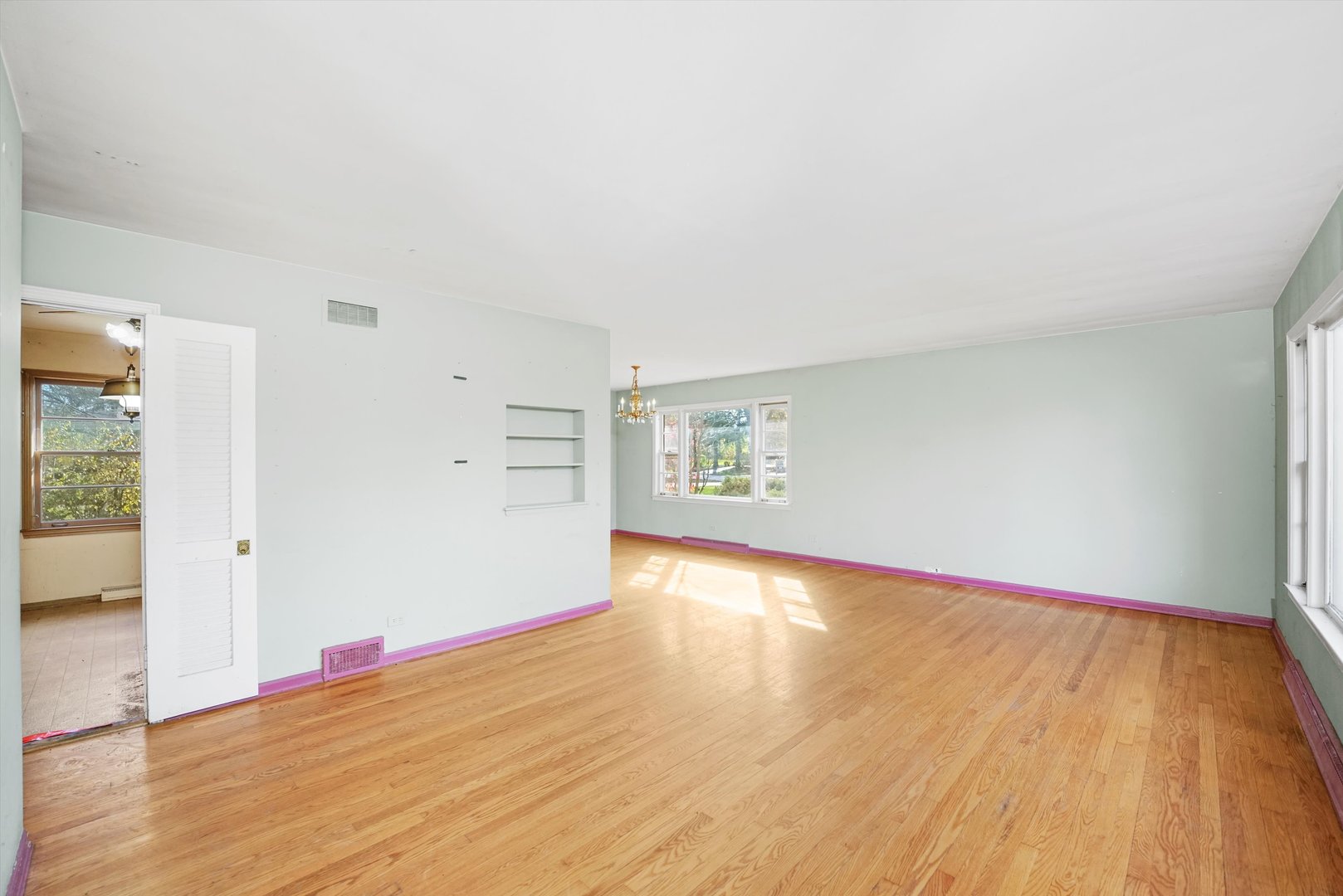 1725 North Happ Road Northbrook, IL 60062 - Photo 5 of 33 a view of empty room with wooden floor and fan