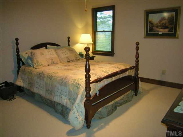 135 Skylark Way Raleigh, NC 27615 - Photo 7 of 14 Generous master bedroom has spacious walk in closet with shelved built in and en suite bath...