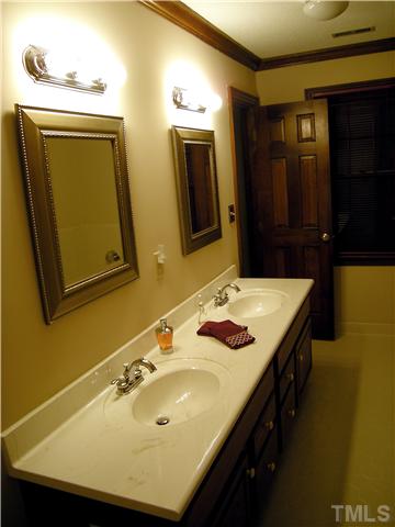 135 Skylark Way Raleigh, NC 27615 - Photo 8 of 14 Roomy Master bath includes dual vanities, separate tub and shower, linen closet, tile floors, and a window to let the sun shine in!