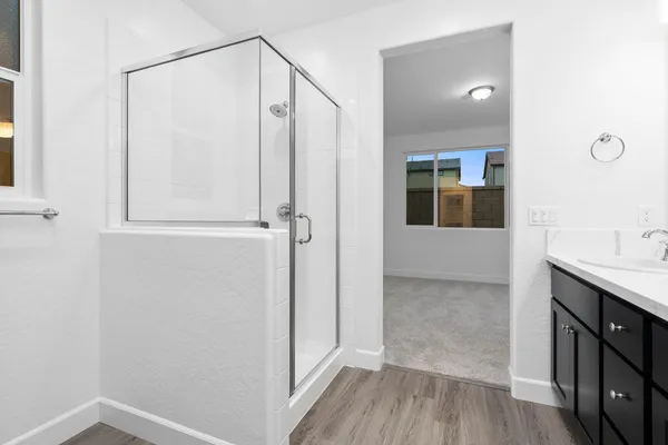 a view of bathroom with a shower and a sink