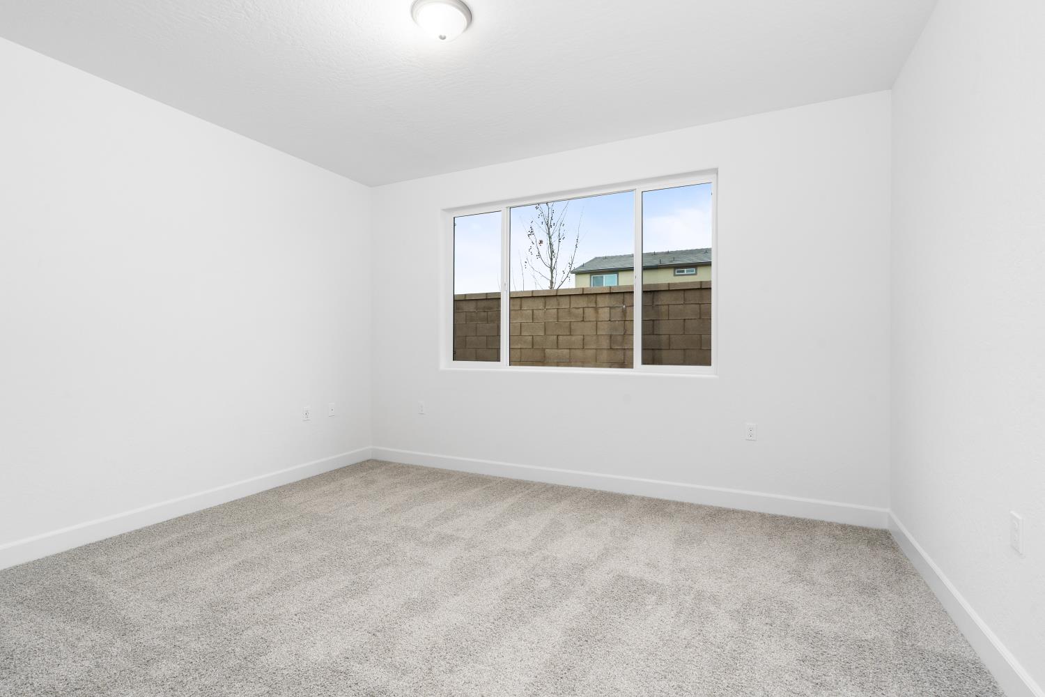 380 South Huckleberry Road Madera, CA 93636 - Photo 13 of 15 an empty room with a window