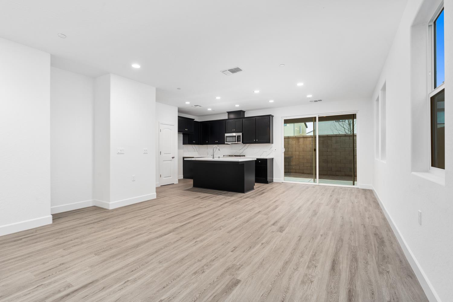 380 South Huckleberry Road Madera, CA 93636 - Photo 5 of 15 a view of kitchen with a refrigerator and a stove top oven