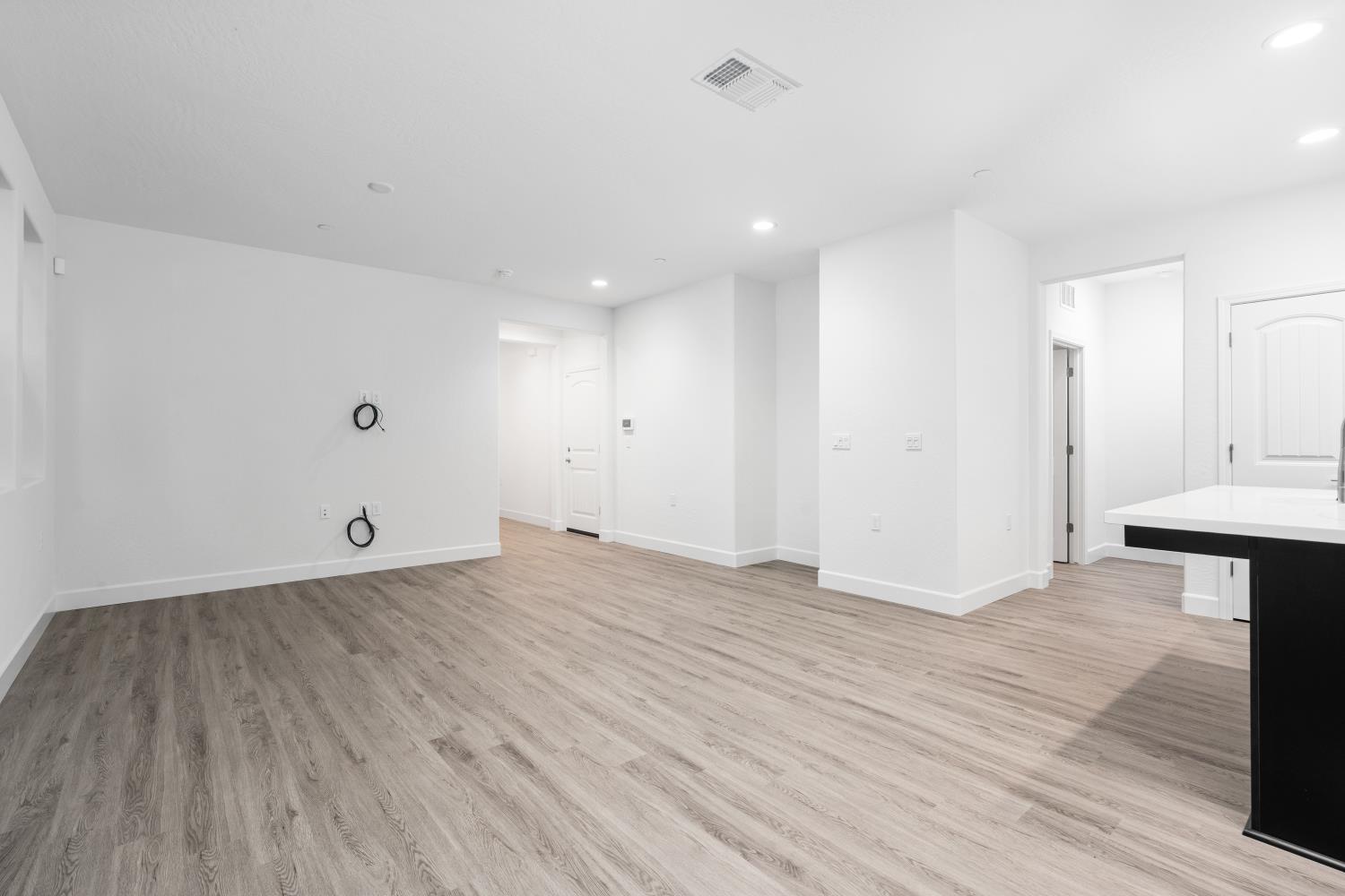 380 South Huckleberry Road Madera, CA 93636 - Photo 6 of 15 a view of an empty room with wooden floor