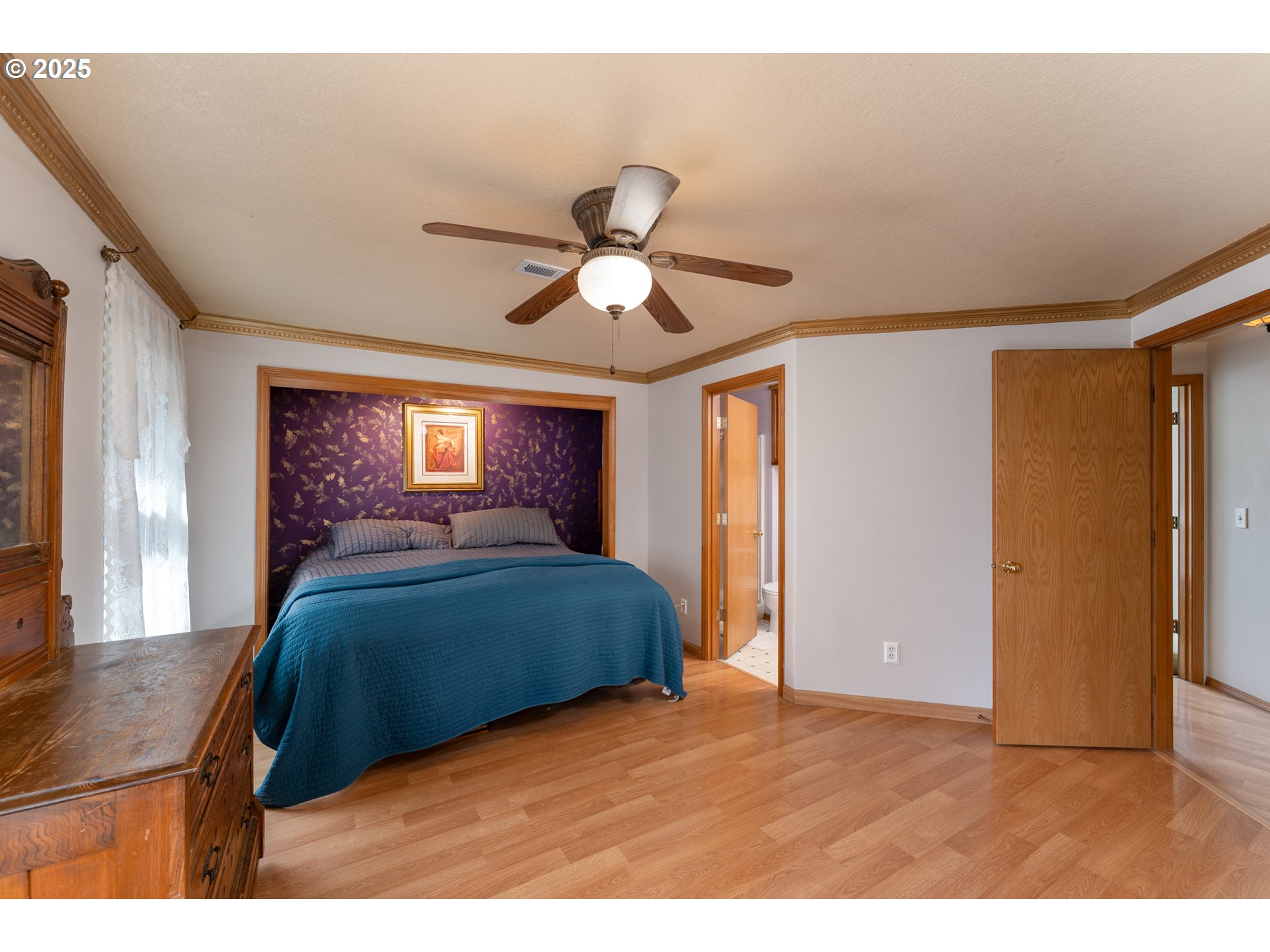 1108 Hadley Road Newberg, OR 97132 - Photo 21 of 42 a bedroom with a bed and a chandelier