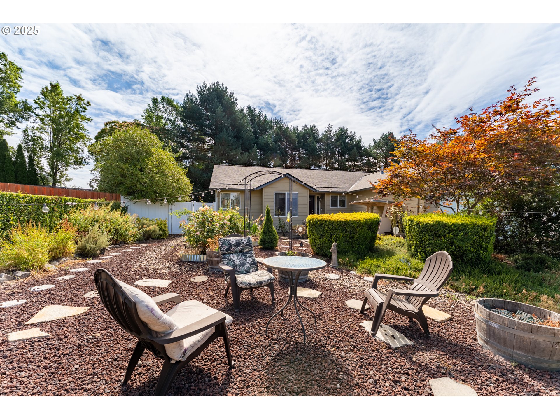 1108 Hadley Road Newberg, OR 97132 - Photo 7 of 42 a view of a patio with chairs and a table