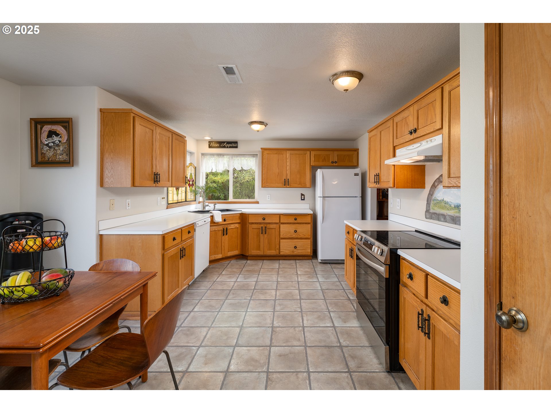 1108 Hadley Road Newberg, OR 97132 - Photo 9 of 42 a kitchen with a sink appliances and cabinets