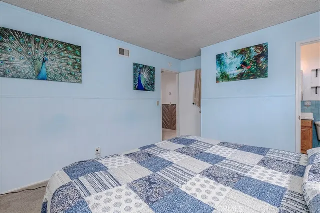 a view of walk in closet with clothes