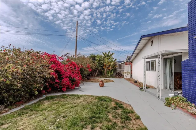 a utility room with cabinets washer and dryer