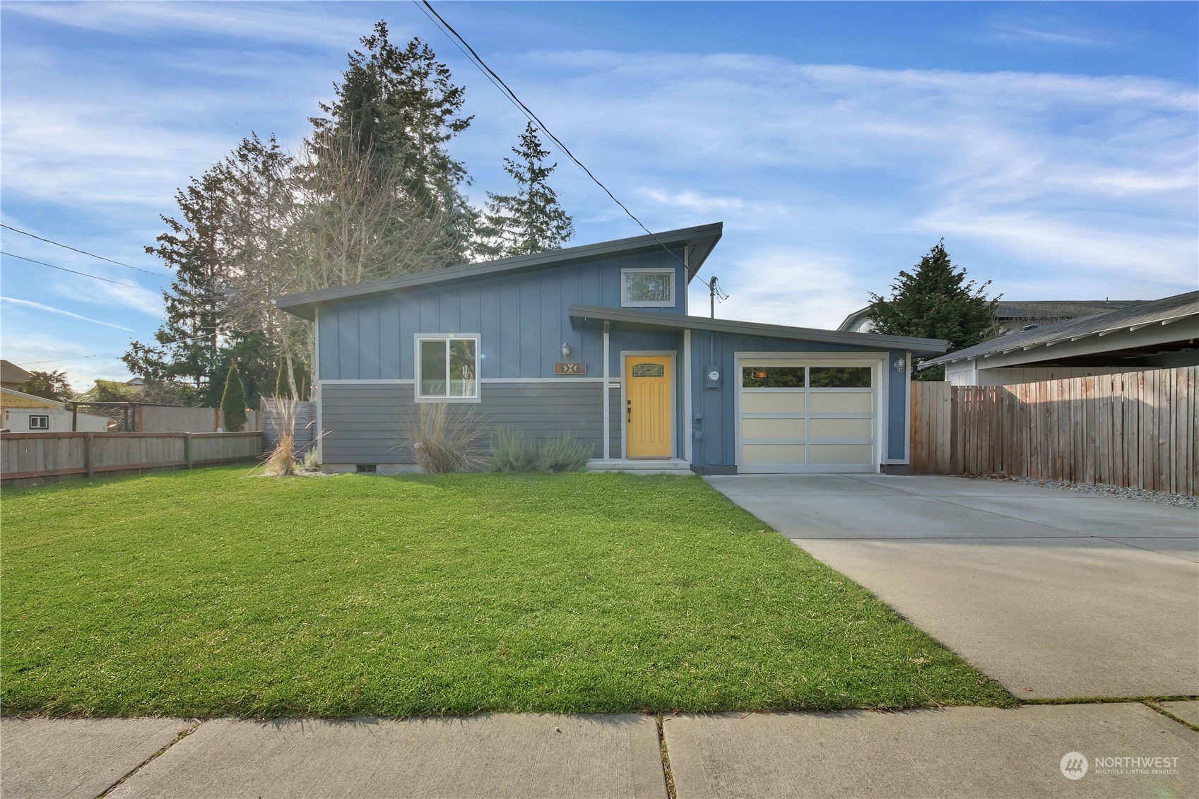 5210 Parker Road East Sumner, WA 98390 - Photo 1 of 25 a backyard of a house with plants and barbeque oven