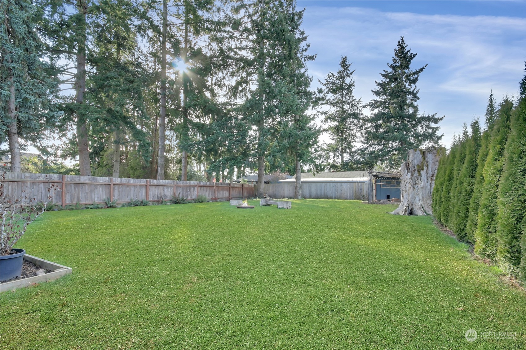 5210 Parker Road East Sumner, WA 98390 - Photo 20 of 25 a view of a backyard with a garden