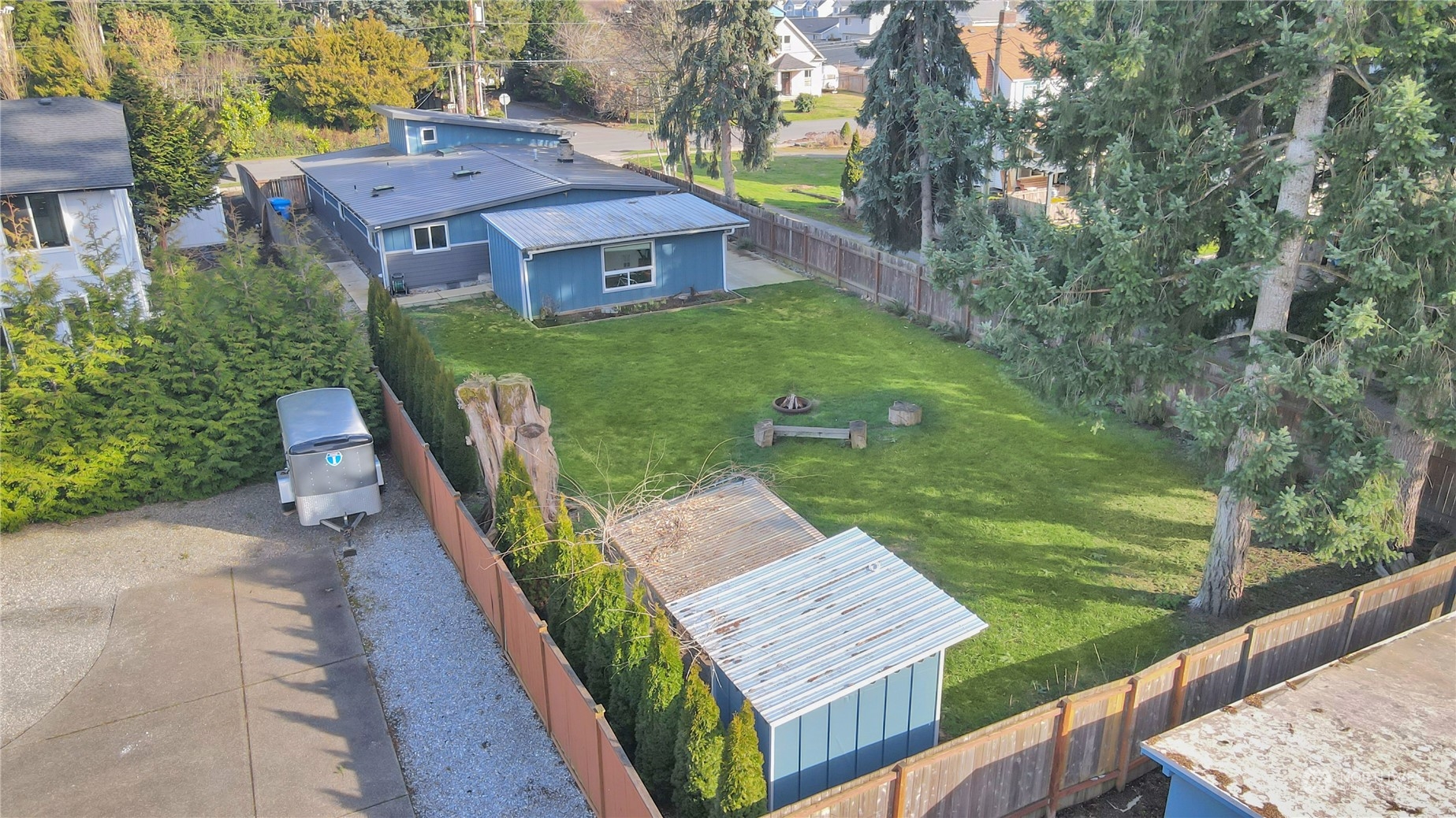 5210 Parker Road East Sumner, WA 98390 - Photo 23 of 25 a view of a wooden deck and a yard