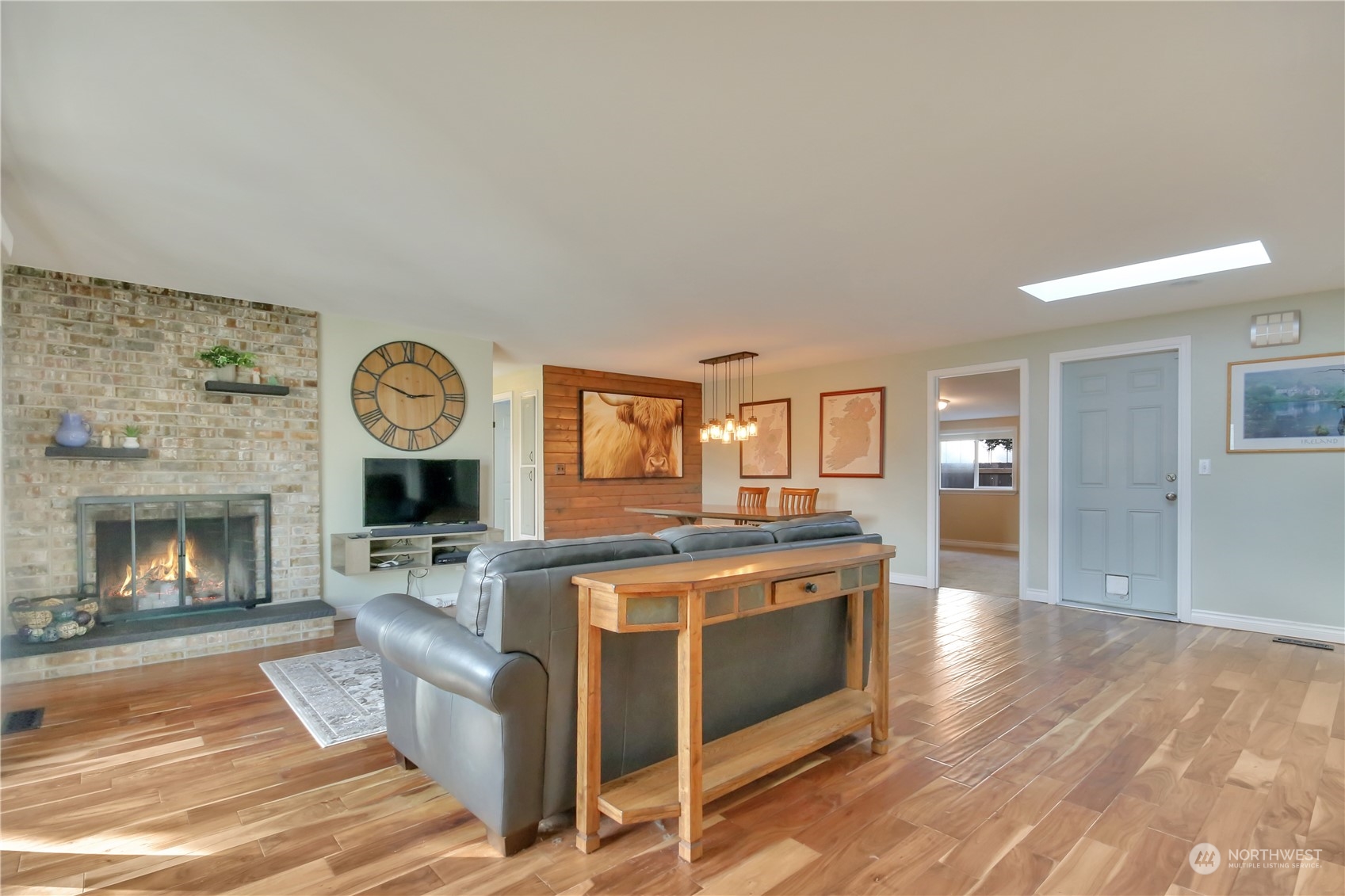 5210 Parker Road East Sumner, WA 98390 - Photo 4 of 25 a view of a kitchen with kitchen island wooden floor and stainless steel appliances