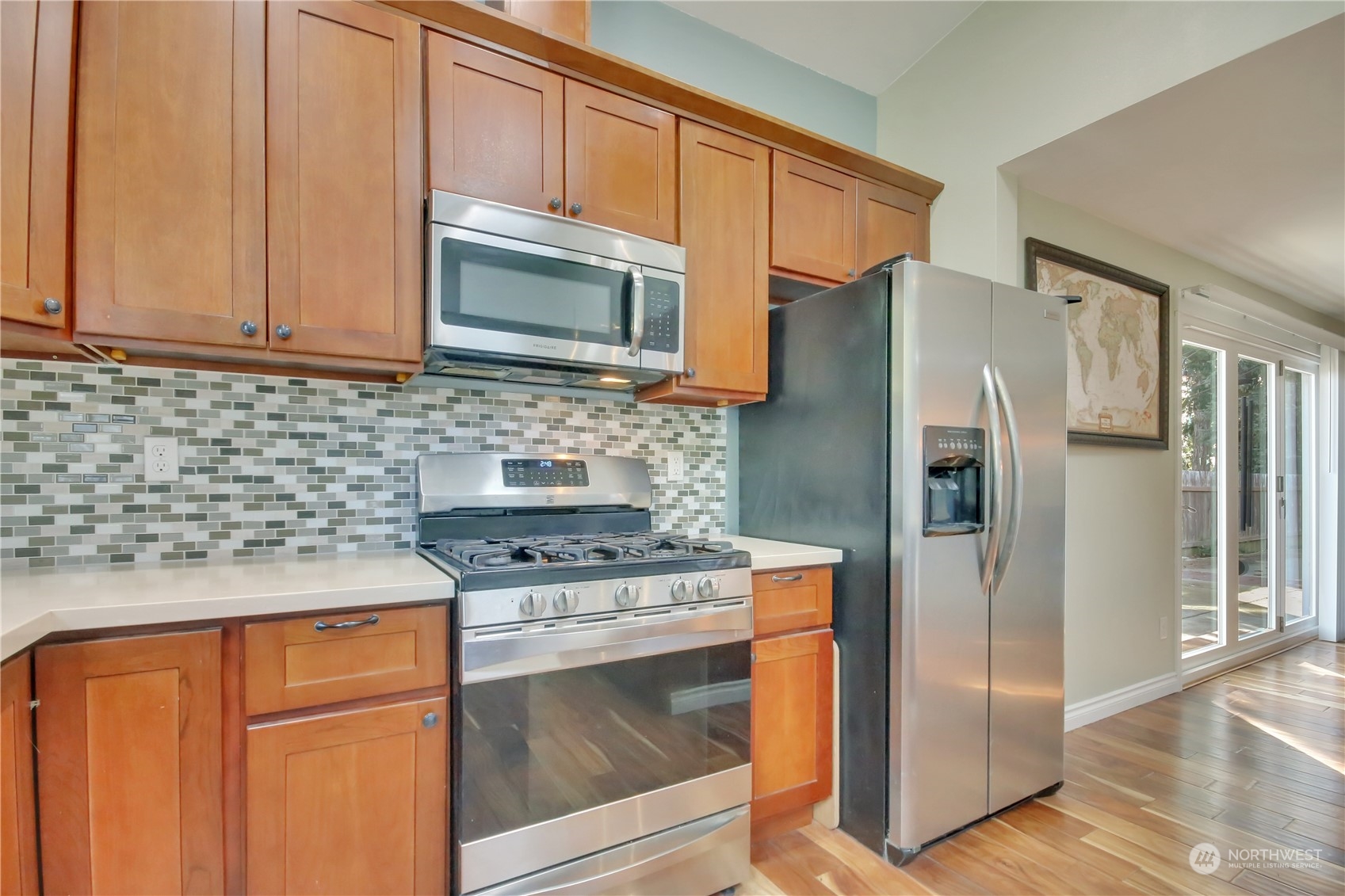 5210 Parker Road East Sumner, WA 98390 - Photo 8 of 25 a kitchen with stainless steel appliances granite countertop a refrigerator stove and sink