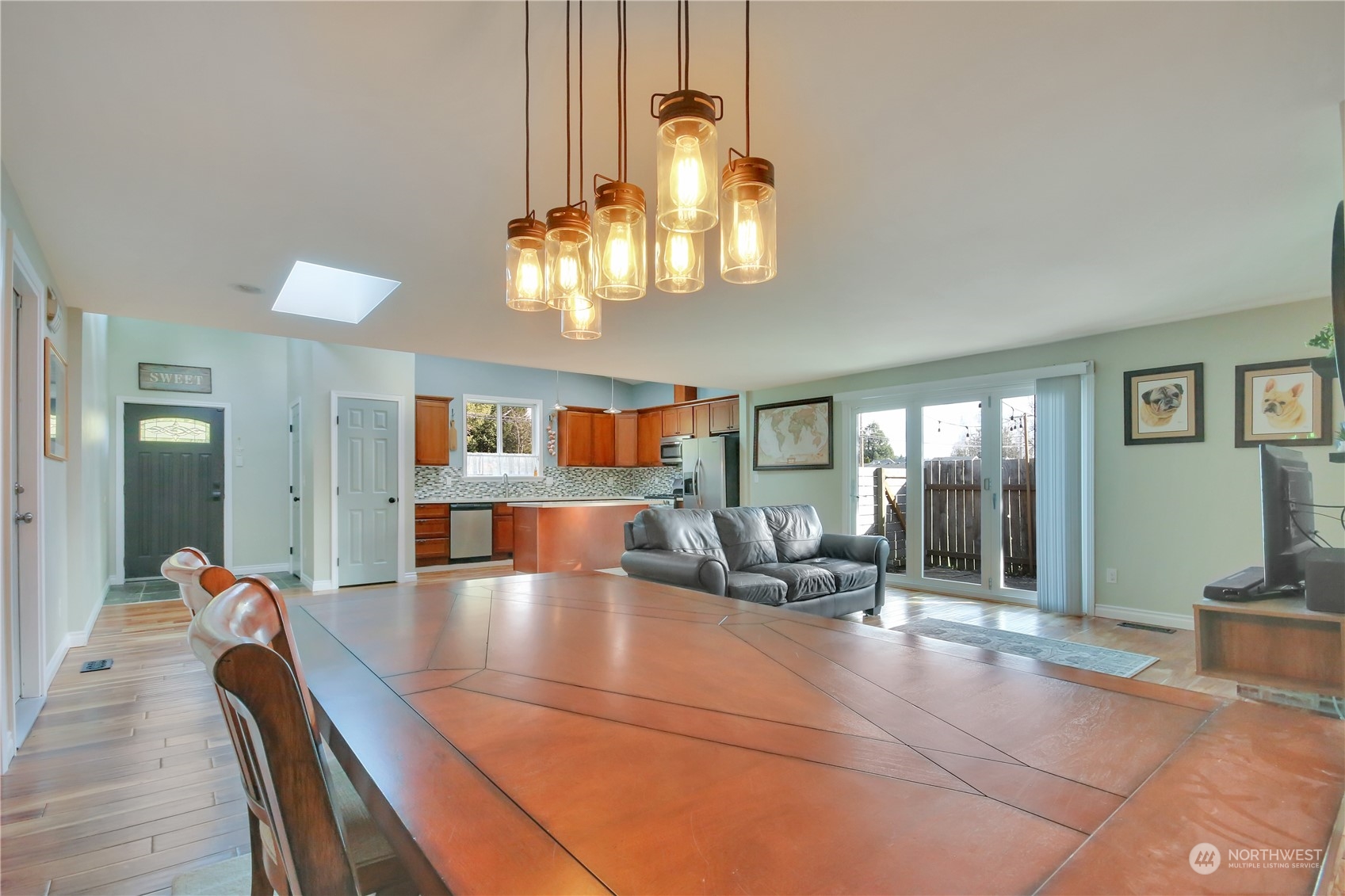 5210 Parker Road East Sumner, WA 98390 - Photo 9 of 25 a view of a dining room with furniture and chandelier