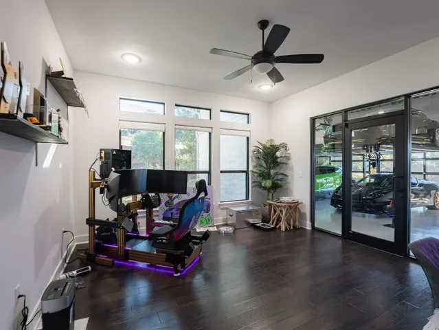 a room with gym equipment and a large window