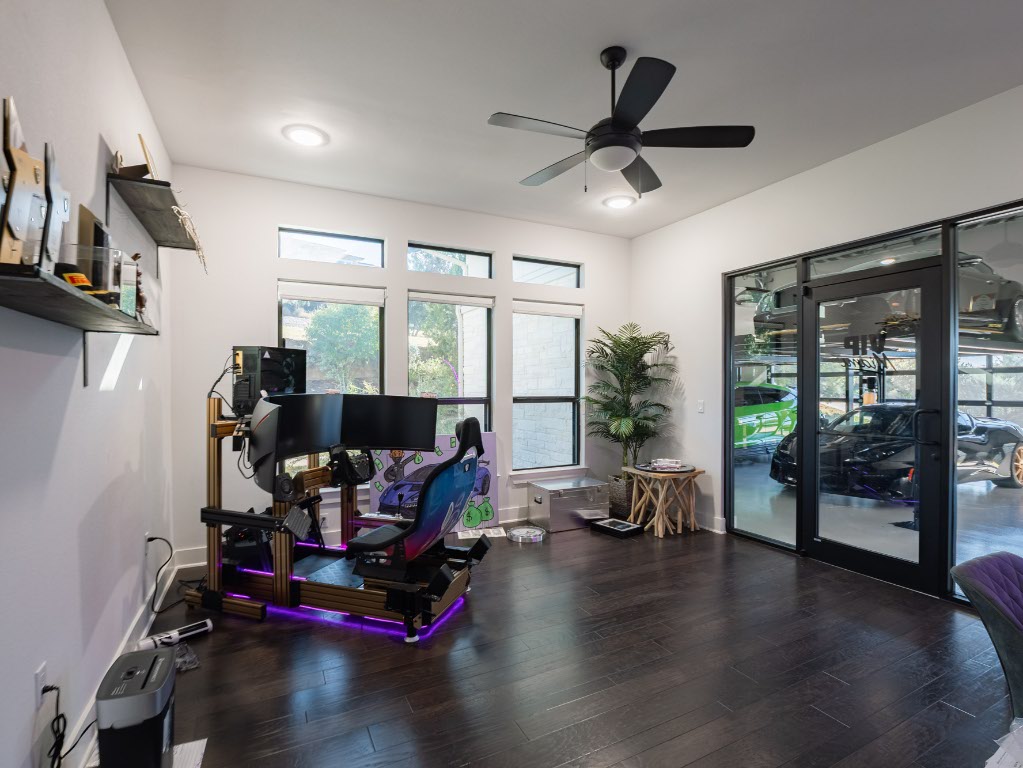 14900 Copper Ridge Lane Austin, TX 78734 - Photo 25 of 39 a room with gym equipment and a large window