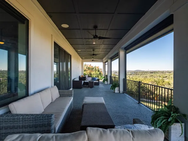 a lobby with furniture and floor to ceiling window