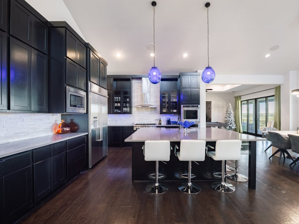 14900 Copper Ridge Lane Austin, TX 78734 - Photo 3 of 39 a view of a dining room with furniture and wooden floor