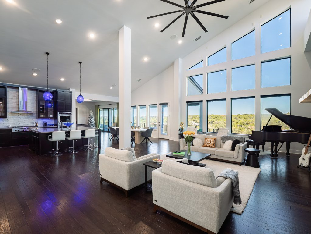 14900 Copper Ridge Lane Austin, TX 78734 - Photo 5 of 39 a living room with furniture or kitchen and a wooden floor