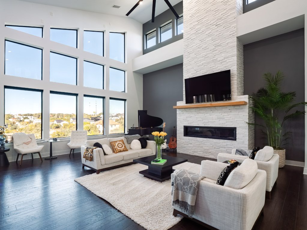 14900 Copper Ridge Lane Austin, TX 78734 - Photo 7 of 39 a living room with furniture a fireplace and a flat screen tv