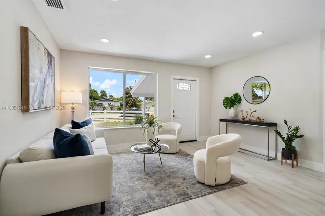 a living room with furniture and window