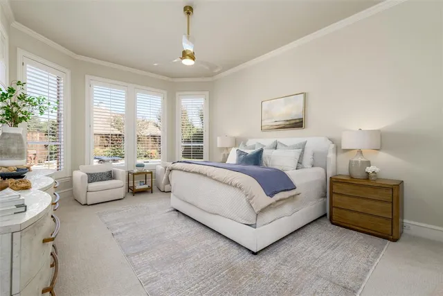 a spacious bedroom with a bed and a couch