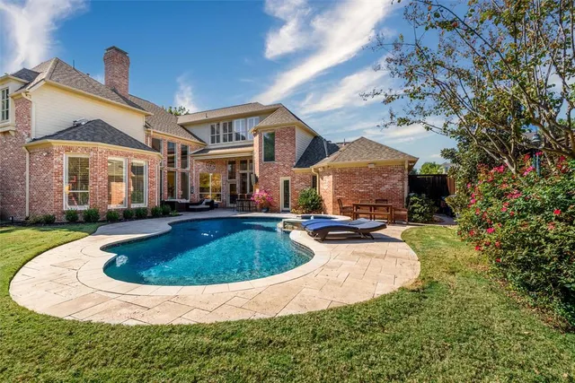 a view of a house with swimming pool