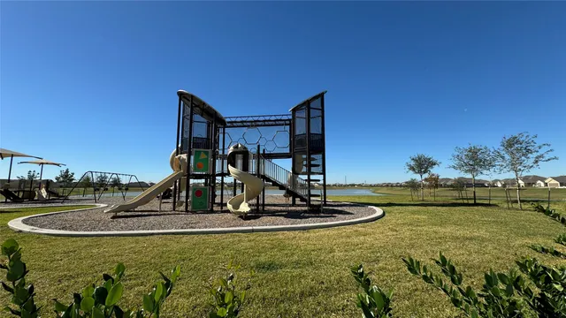 a view of a swimming pool with a yard