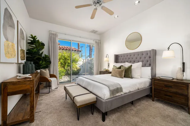 a bedroom with bed and a window