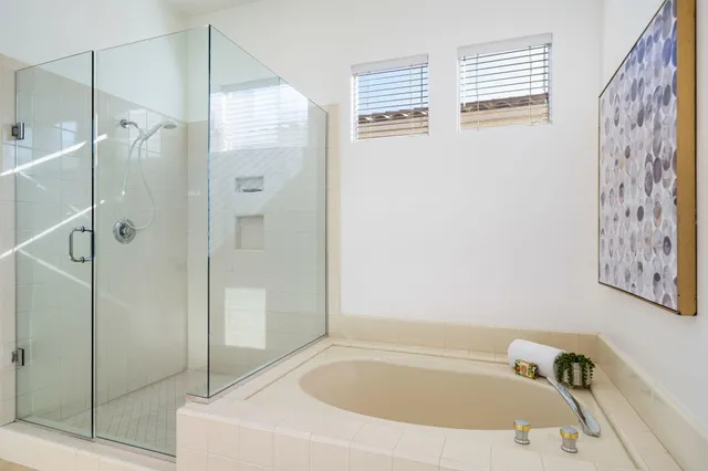 a bathroom with a tub and shower