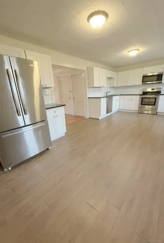 a view of a kitchen with a sink