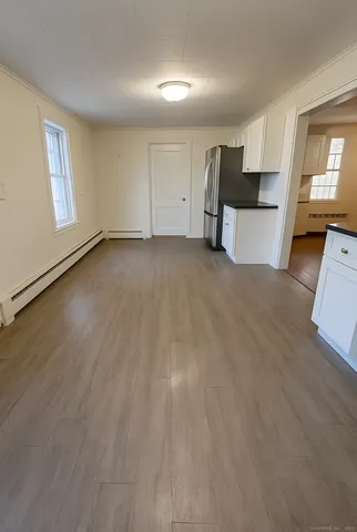 a view of a kitchen with a sink cabinets and a window