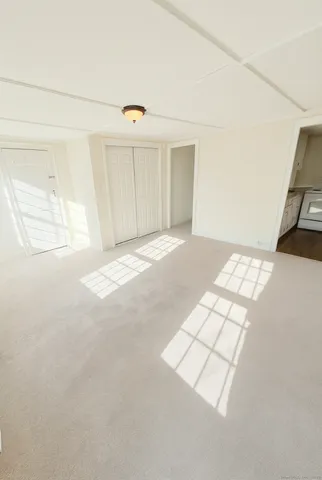 a view of a room with wooden floor and sink