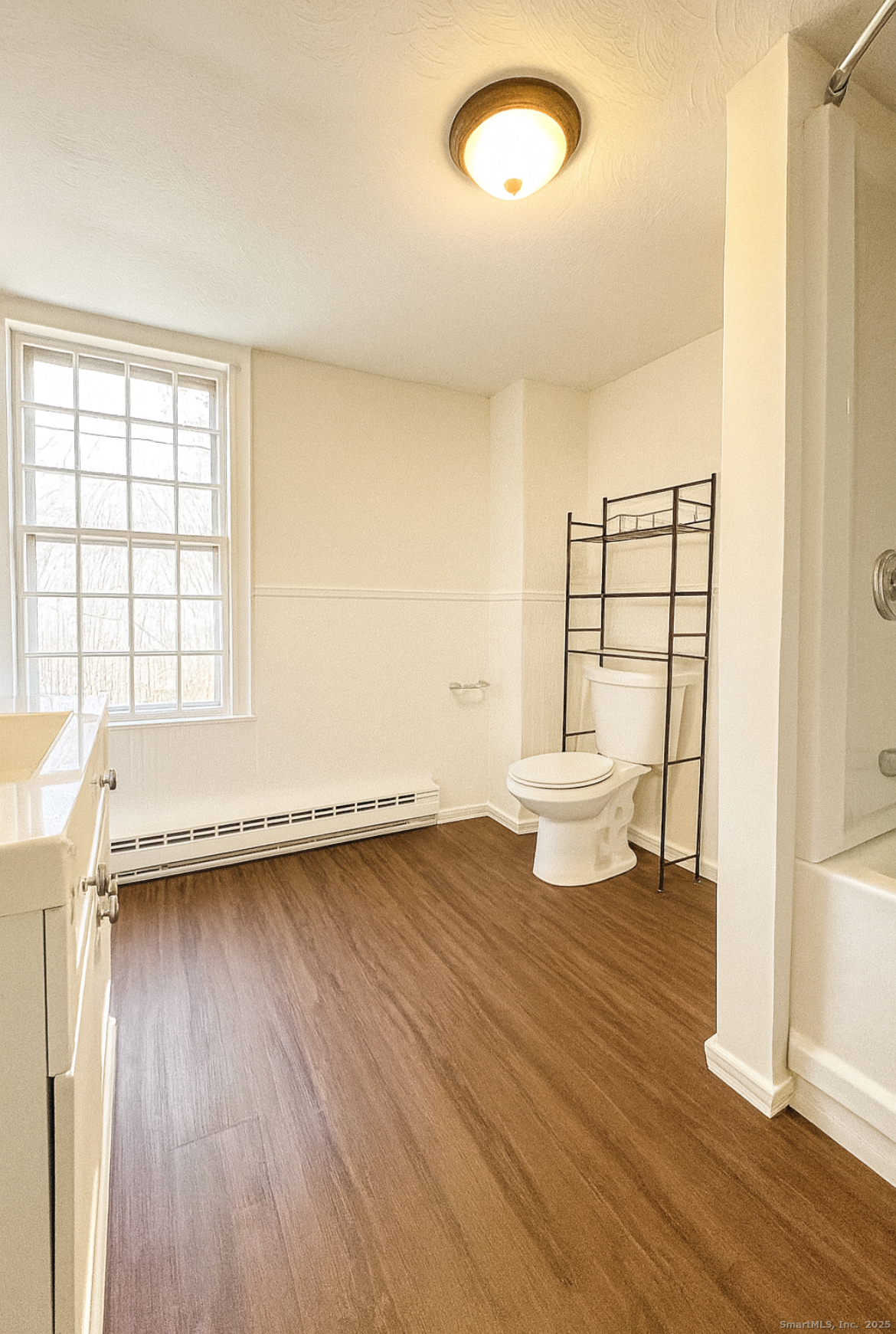 1281 Durham Road Madison, CT 06443 - Photo 21 of 24 a view of a room with wooden floor and sink