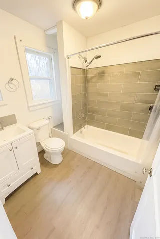 a bathroom with a bathtub sink and toilet