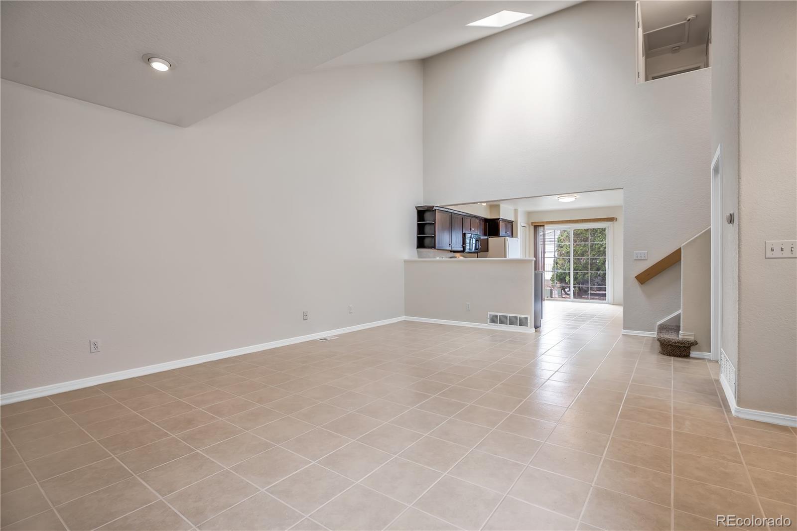 11690 West 46th Avenue Wheat Ridge, CO 80033 - Photo 8 of 33 an empty room with windows