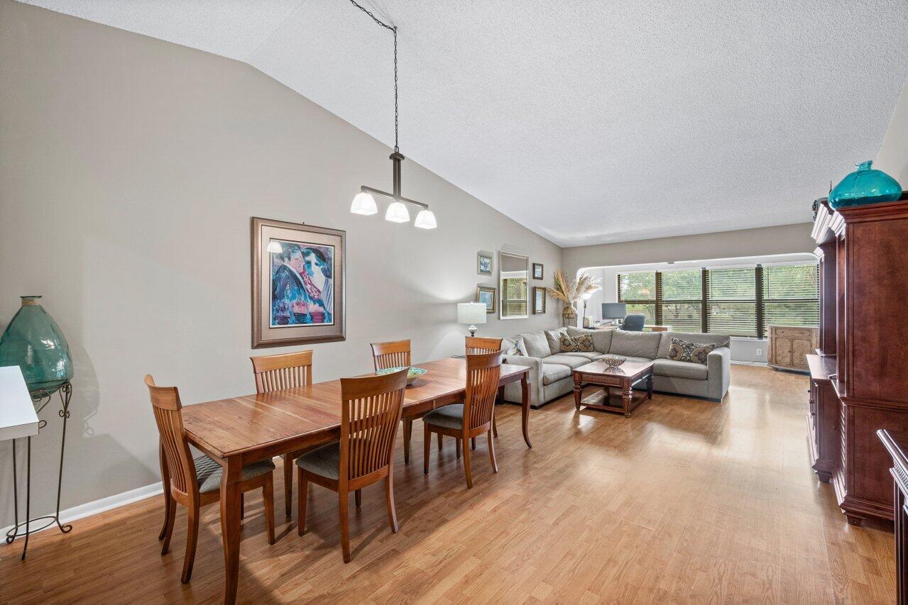 5020 Golfview Court, Unit 1426 Delray Beach, FL 33484 - Photo 1 of 50 a living room with furniture and a large window