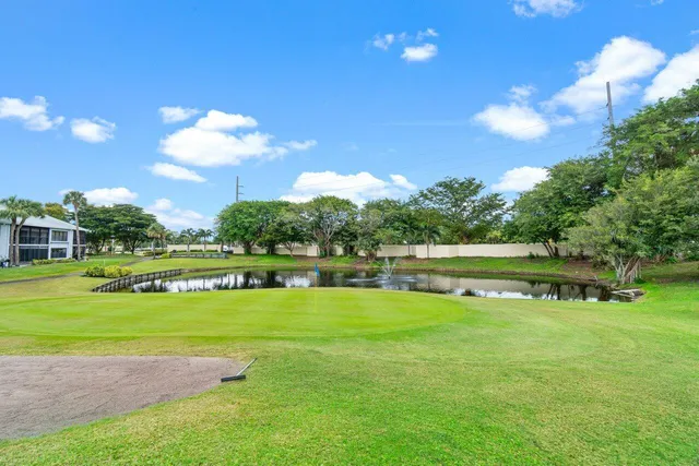 a view of a lake with a yard