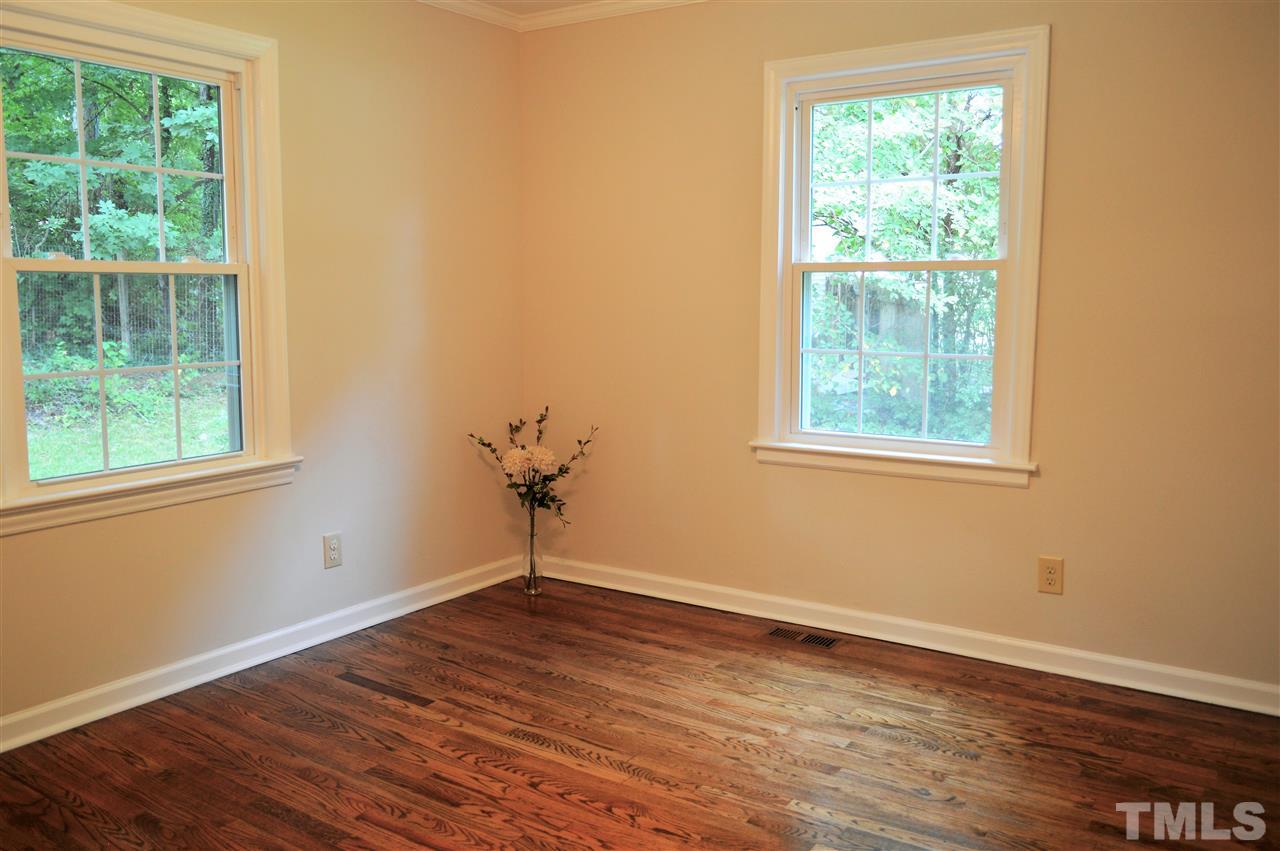 2387 Stevens Road Raleigh, NC 27610 - Photo 13 of 25 an empty room with wooden floor and windows