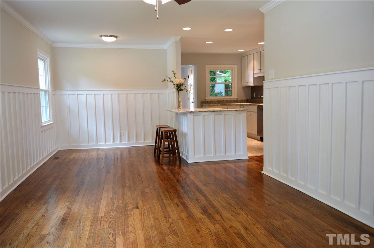 2387 Stevens Road Raleigh, NC 27610 - Photo 3 of 25 a view of a kitchen with wooden floor and electronic appliances
