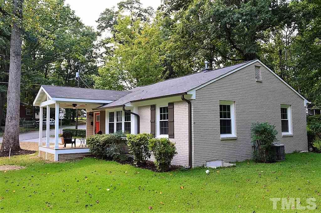 2387 Stevens Road Raleigh, NC 27610 - Photo 22 of 25 a front view of a house with a garden and yard
