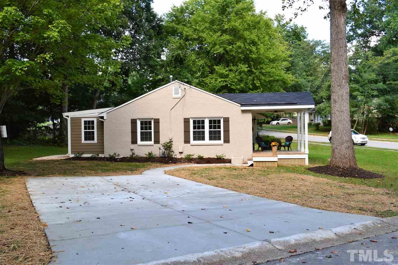 2387 Stevens Road Raleigh, NC 27610 - Photo 23 of 25 a view of a yard with a house and a big tree