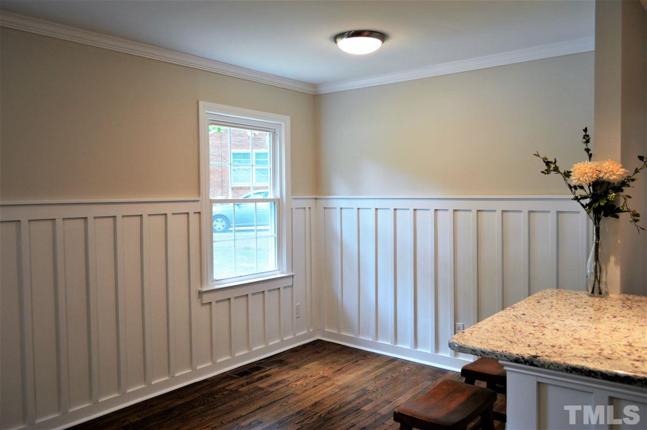 2387 Stevens Road Raleigh, NC 27610 - Photo 4 of 25 a view of a bedroom with wooden floor & a window