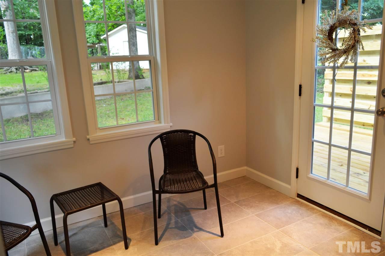 2387 Stevens Road Raleigh, NC 27610 - Photo 9 of 25 a view of a workspace room with furniture and a window