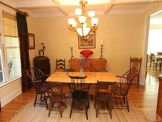 3004 Wyntree Ridge Way Raleigh, NC 27606 - Photo 6 of 25 Large dining room with coffered ceilings and beautiful chandelier. Perfect for entertaining.