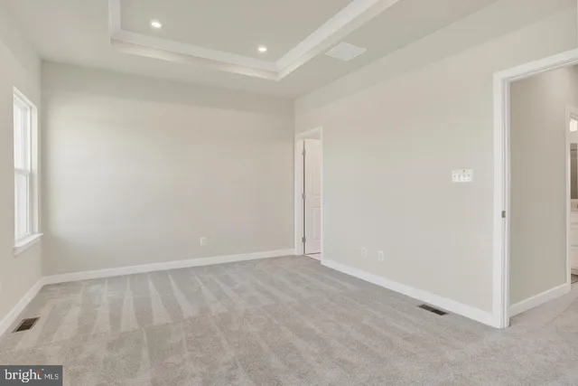 a bathroom with a bathtub shower sink mirror and toilet